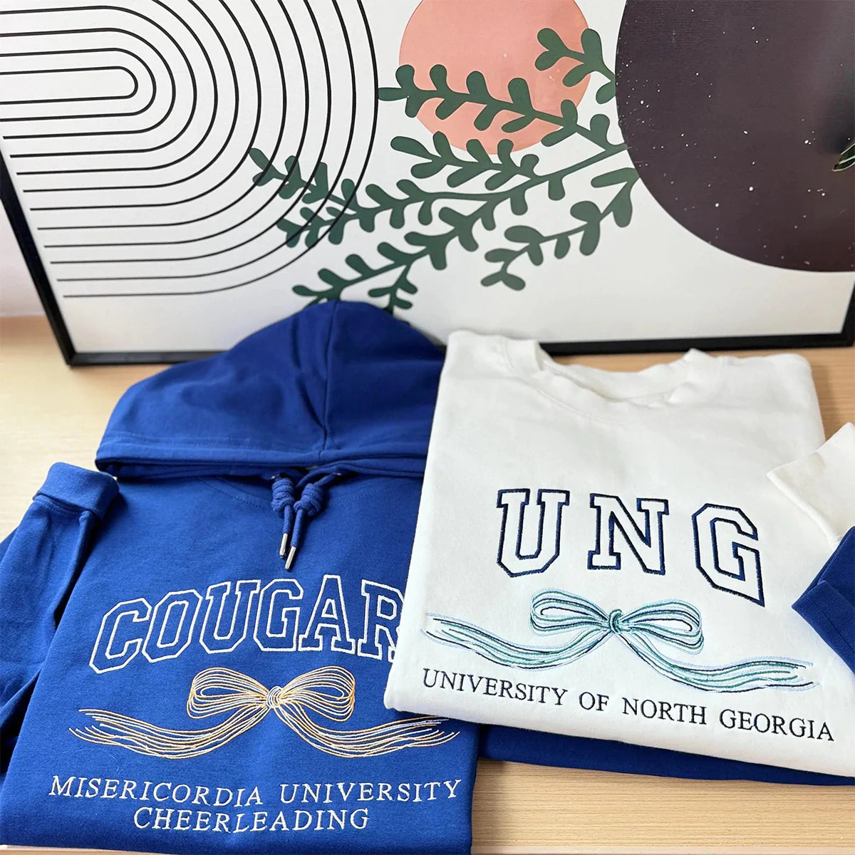 University hoodie with embroidered initials and bow