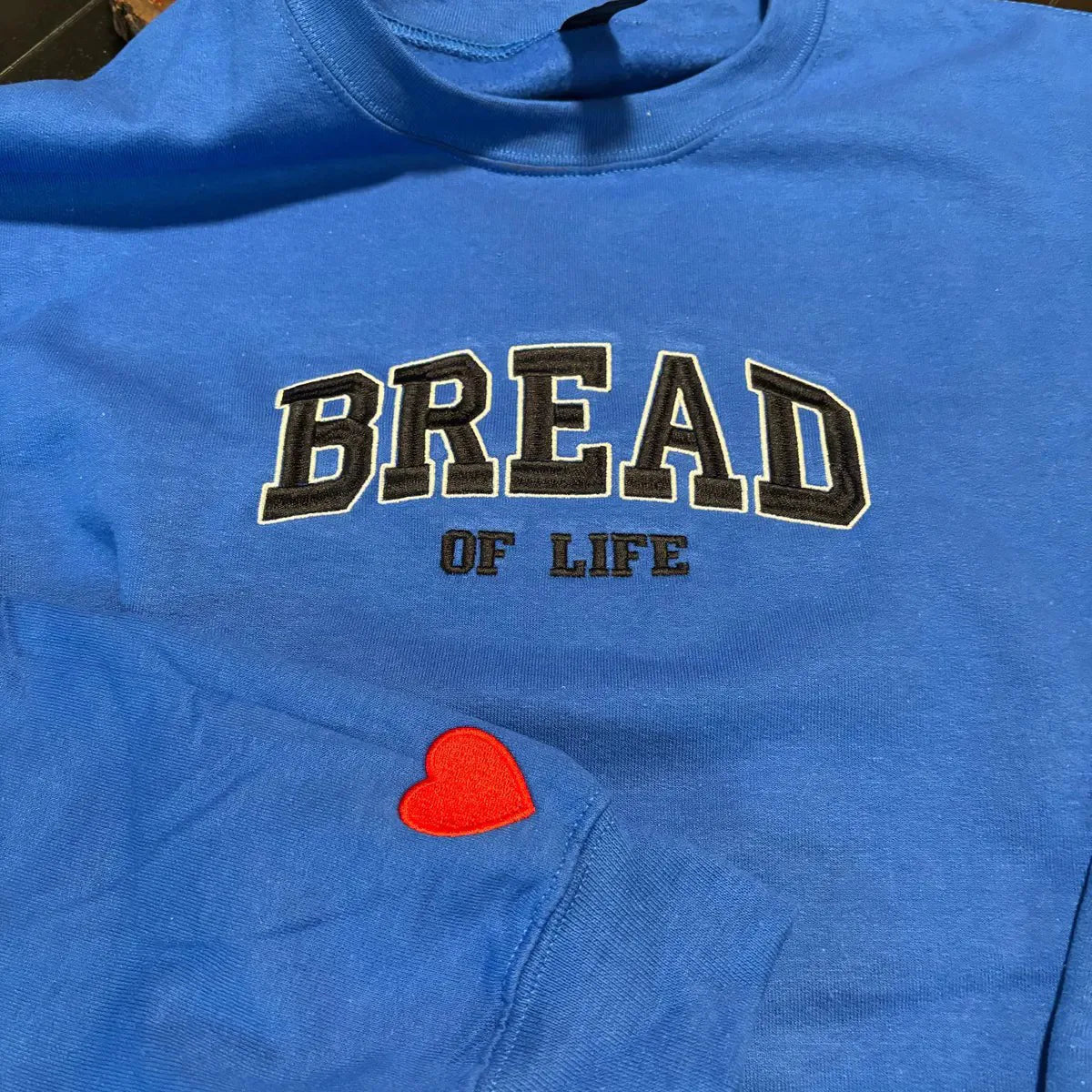 Anniversary sweatshirt with embroidered message