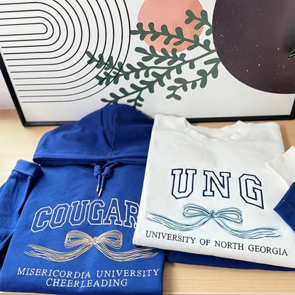 University hoodie with embroidered initials and bow